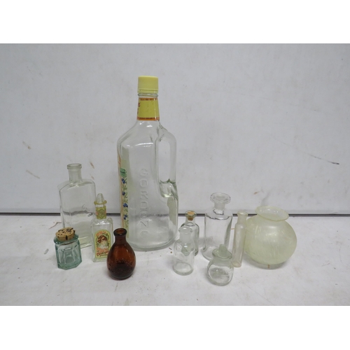 116 - Selection of various glass bottles.