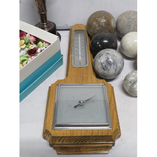 91 - Selection of various china flower posies, polished stone balls, vintage barometer and a Trophy.