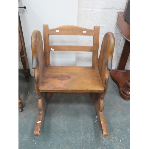 300 - Pleasing Childs Wooden Rocking Chair with Ducks head Carved decoration to sides.