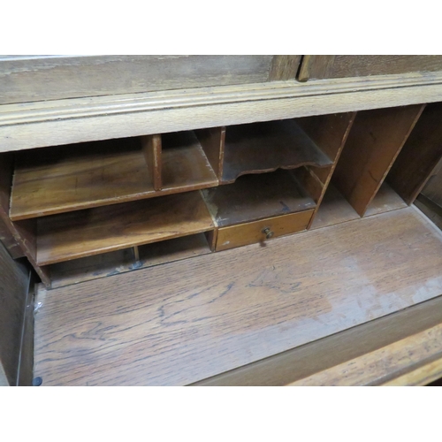 304 - Light Oak Bureau/Secretaire with Leaded Glass doors to top. Measures H;77 x W:29 x D:16 Inches.