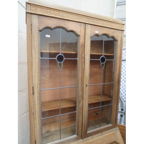 304 - Light Oak Bureau/Secretaire with Leaded Glass doors to top. Measures H;77 x W:29 x D:16 Inches.