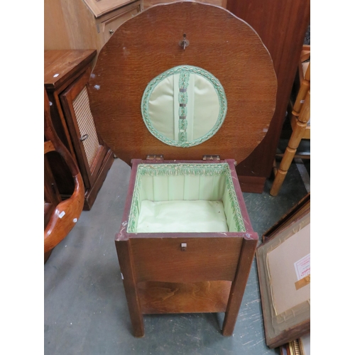 305 - 1930's Darkwood Sewing table witjh lifting lid and silk lined interior. Measures 19 inches tall. See... 