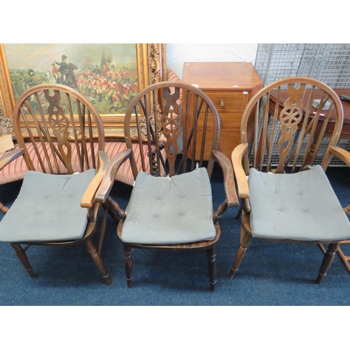 320 - Three Darkwood Wheelback chairs with armrests. See photos S2