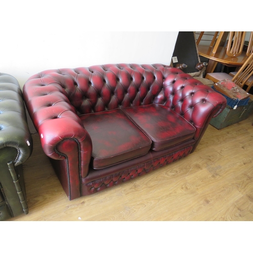 322 - Two Seater Chesterfield Sofa upholstered in Oxblood Leather  60 inches long.  S2