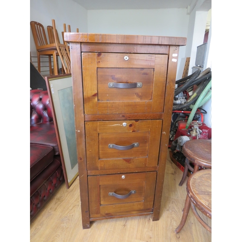 327 - Antique Style Reproduction Three drawer filing cabinet in stained pine. See photos S2