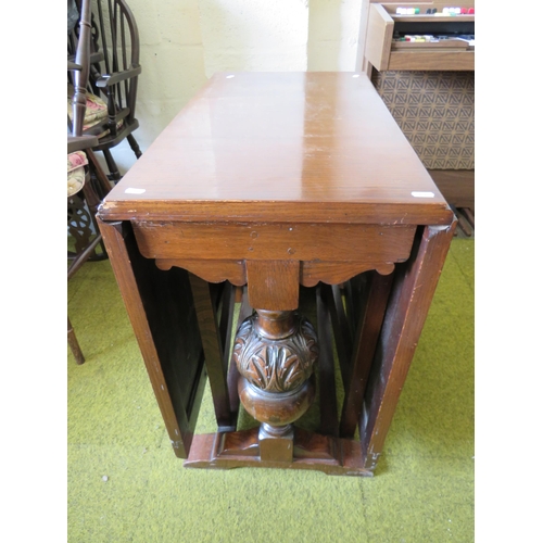 360 - Heavily contsructed Oak Drop leaf Table with large balluster suppors. H:29 x W:65 x D:29 inches. See... 