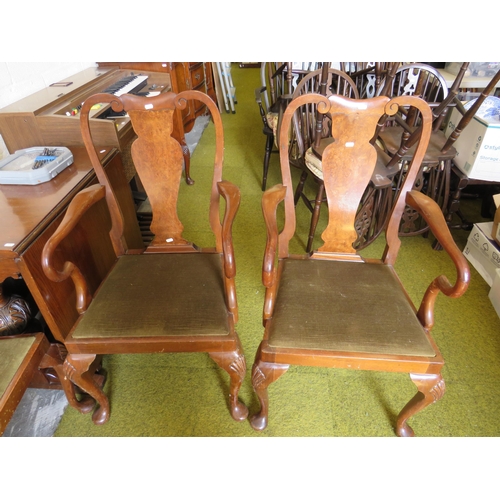 362 - Four Dark wood dining chairs with two carvers. See photos