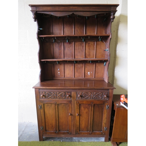 363 - Darkwood Dresser with ornate carved drawers, plate rack above. Measures H:82 x W:48 x D:18 inches.