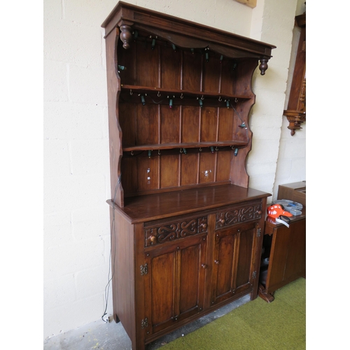 363 - Darkwood Dresser with ornate carved drawers, plate rack above. Measures H:82 x W:48 x D:18 inches.