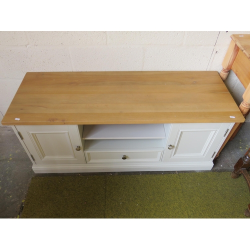 366 - Low painted cupboard with beech top, soft close lower drawer. Raised on a plinth base it measures H:... 