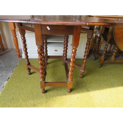 369 - Vintage Oak Drop leaf table with barley twist legs. H:30 inches. See photos.