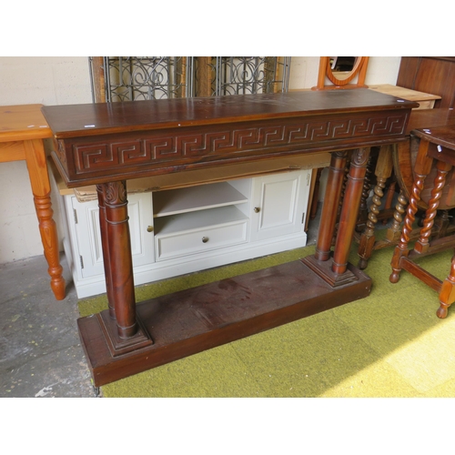 370 - Interesting Mahogany Console table with greek style carved decoration. Raised on a block base and tw... 