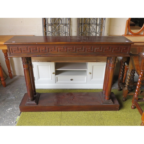 370 - Interesting Mahogany Console table with greek style carved decoration. Raised on a block base and tw... 