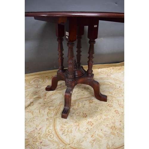 178 - Lovely Circular topped table with four column pedestal raised on curved bracket feet. Measures appro... 