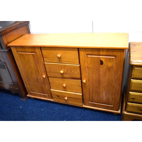 440 - Pine Cupboard with four central drawers plus two side cupboards.  Needs TLC. See photos.   H:32