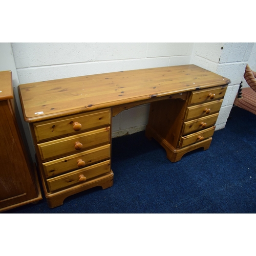 441 - Pine kneehole dresser with four drawers to each side Measures approx H:28 x W:59 x D:17 inches. See ... 