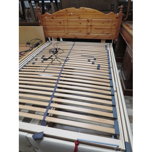 161 - Double electric bed with pine headboard, 55