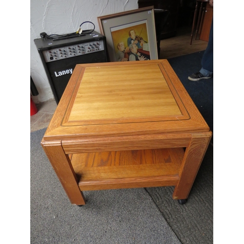 526 - Light wooden coffee table on castors, 26