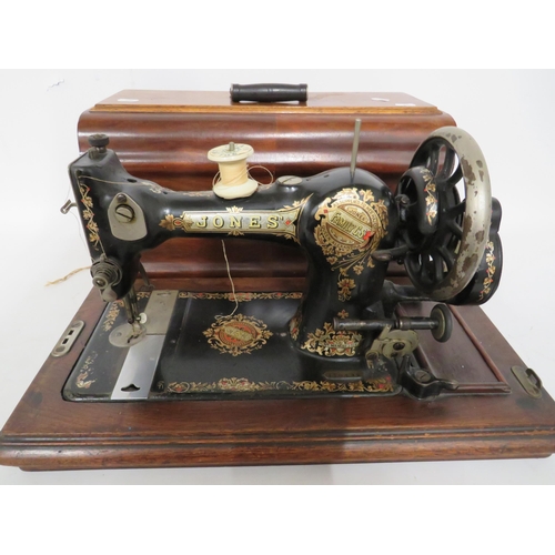 231 - Jones Vintage Sewing machine with original box. Serial number 110492. In running order with case and... 