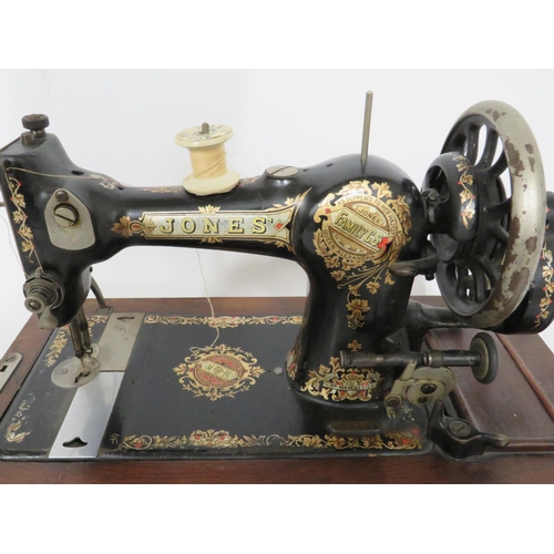 231 - Jones Vintage Sewing machine with original box. Serial number 110492. In running order with case and... 