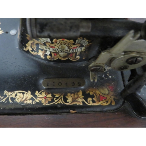 231 - Jones Vintage Sewing machine with original box. Serial number 110492. In running order with case and... 