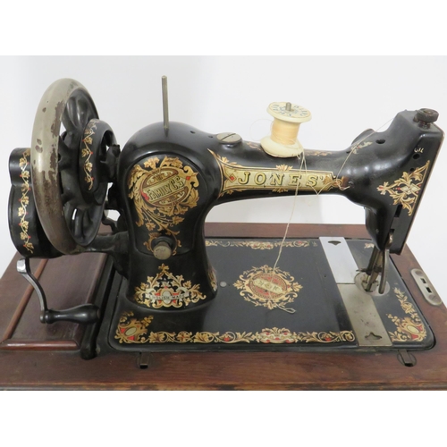 231 - Jones Vintage Sewing machine with original box. Serial number 110492. In running order with case and... 