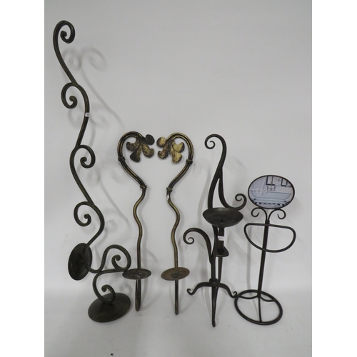 236 - Selection of metal candle holders, largest is 35 inches tall. See photos.