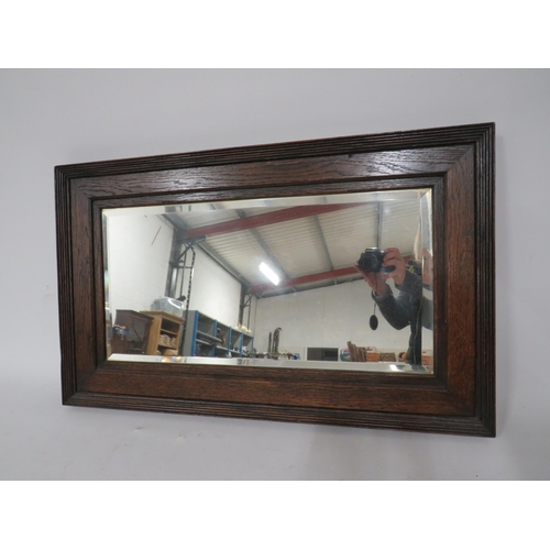 470 - Antique dark oak surround bevel edge mirror, 30.5