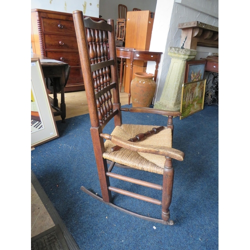 527 - Unusual rocking chair with metal sledge rockers, in need of some slight repair.