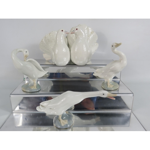 24 - Lladro figurine of a pair of doves and 3 geese.