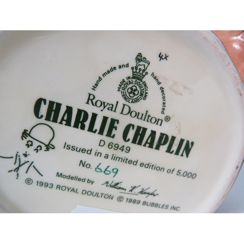 105 - Three Royal Doulton Toby Jugs Charlie Chaplin, Henry VIII & Monty.