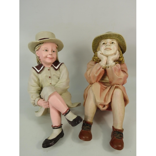 67 - Two large seated shelf figuines of vintage girls, makers marks to the rear, approx 12