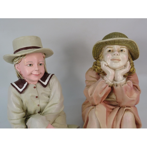 67 - Two large seated shelf figuines of vintage girls, makers marks to the rear, approx 12