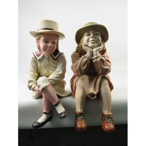 67 - Two large seated shelf figuines of vintage girls, makers marks to the rear, approx 12