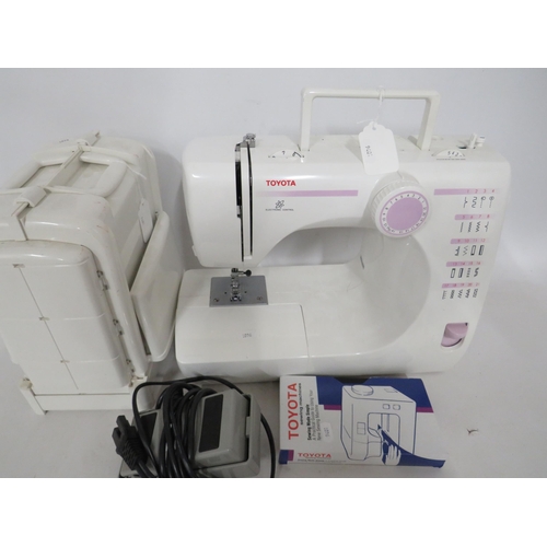 120 - Toyota Electric Sewing machine in running order along with a folding bobin case. Comes with Manual. ... 