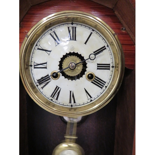 57 - Vintage Mantle Clock in Running order. Approx 14 inches tall.