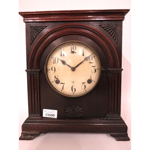 60 - Vintage Mantle Clock in running order. Door to rear is damaged for repair  Approx 13 inches tall.