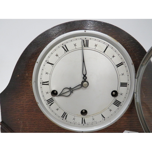 62 - Vintage Mantle clock in running order with key  Approx 9 inches tall.