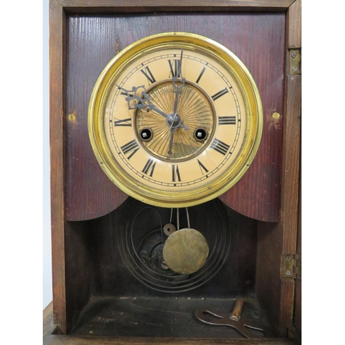 69 - Vintage Mantle Clock running order with key. Approx 14 inches tall.