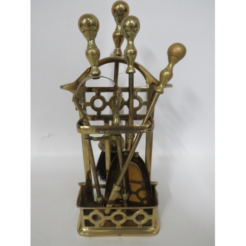 82 - Small Brass Fireside Companion set in complete condition . Measures approx 12 inches tall.