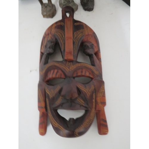 89 - Selection of Carved African figures plus tribal mask which is 10 inches long.