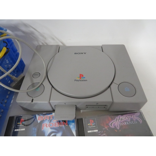 91 - Sony Playstation with controls, games and large amount of wiring.  Working condtion unknown.