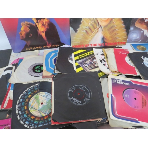 151 - Eight Vinyl Lps and a selection of 45s. The Police, Abba, U2 etc.