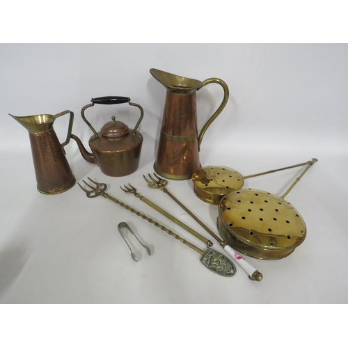 173 - Brass and copper kettle, Two jugs and a selection of brass fire side items.