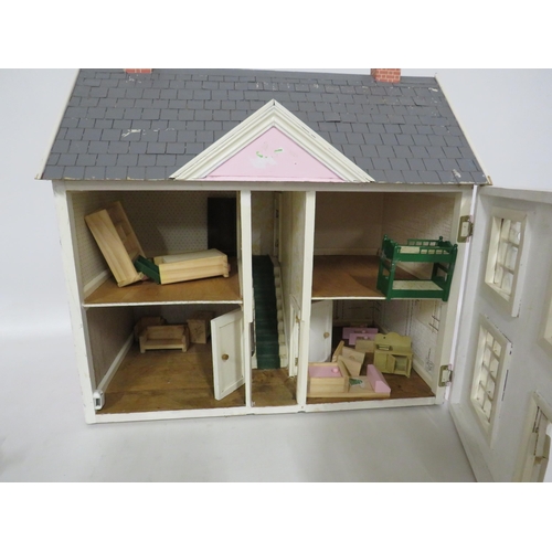 180 - Dolls house with dolls furniture. 24