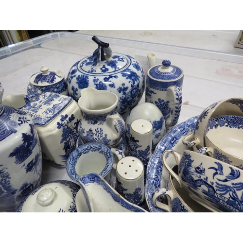 215 - Large tray of blue and white ceramics mainly willow pattern.