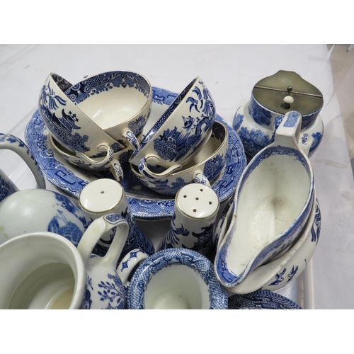 215 - Large tray of blue and white ceramics mainly willow pattern.