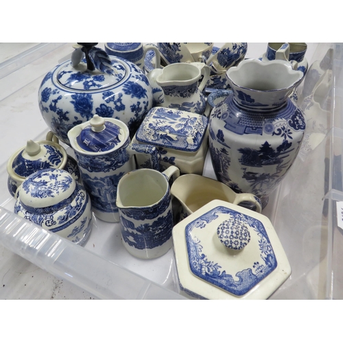 215 - Large tray of blue and white ceramics mainly willow pattern.