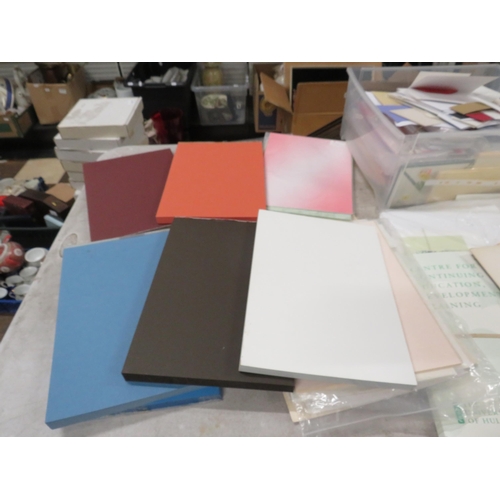 243 - Large selection of crafting paper and envelopes.