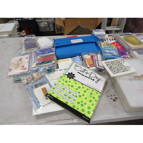 244 - Large selection of crafting paper and card making supplies.